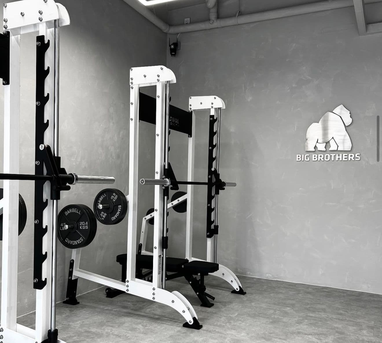 Big Brothers Fitness gym interior with weight racks and strength-training equipment